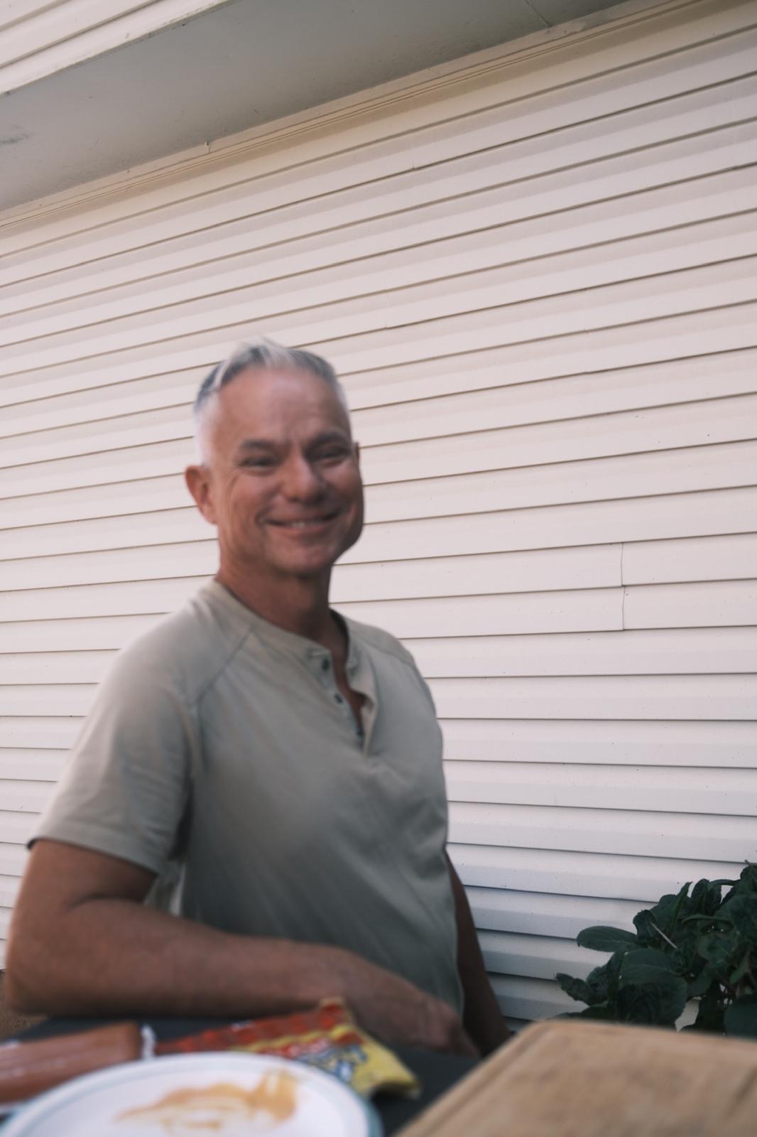José Montes smiling outside a home